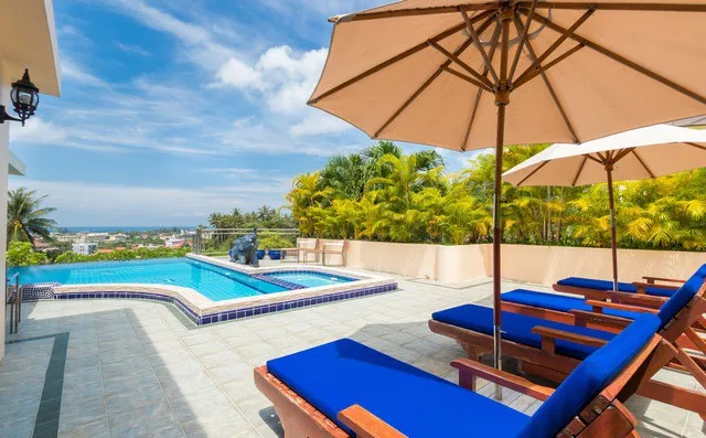 Outdoor lounging area by the pool
